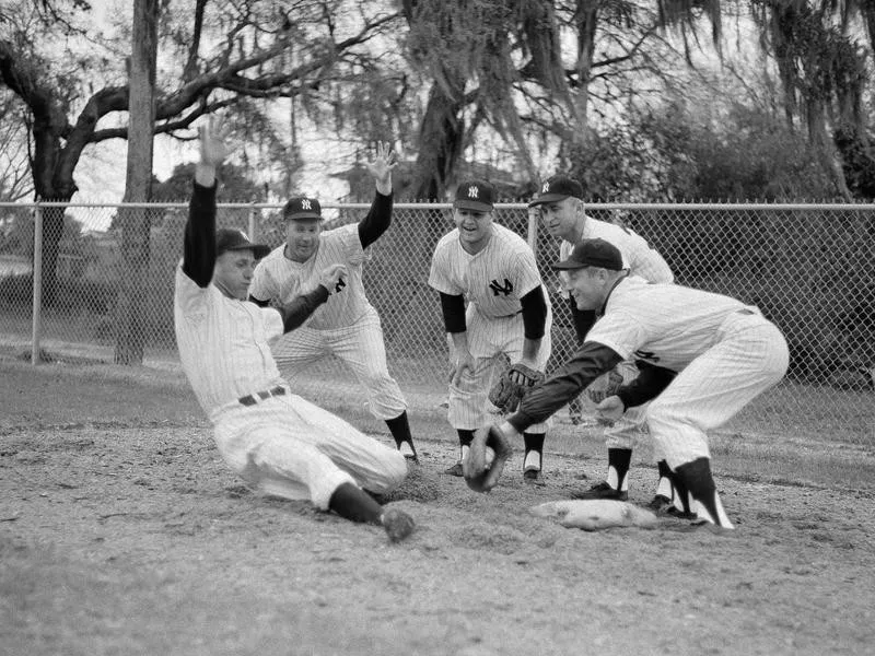 Frankie Crosetti demonstrating slide to young players