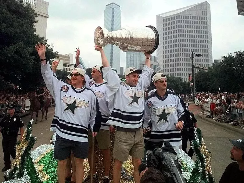 Guy Carbonneau with teammates and Stanley Cup