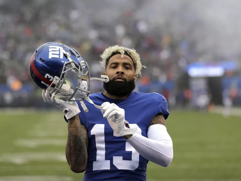 Odell Beckham adjusts his helmet