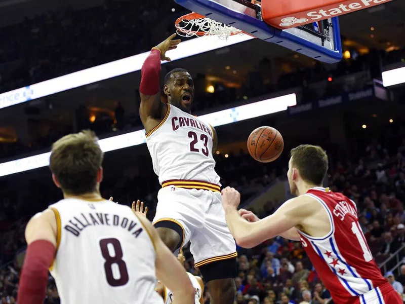 LeBron James dunks over Nik Stauskas on Nov. 2, 2015