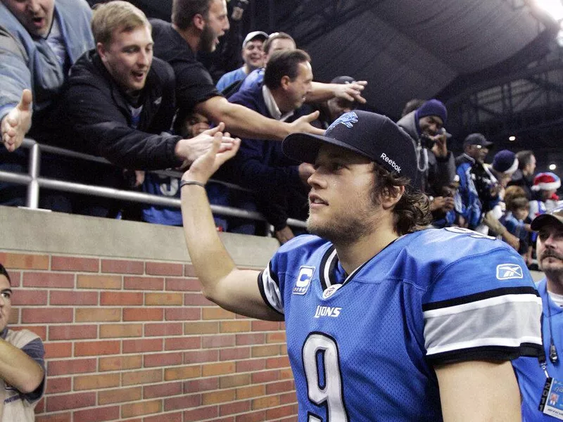 Matthew Stafford high-fives Detroit Lions fans