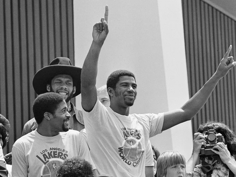 Earvin Magic Johnson and teammates Norm Nixon celebrating