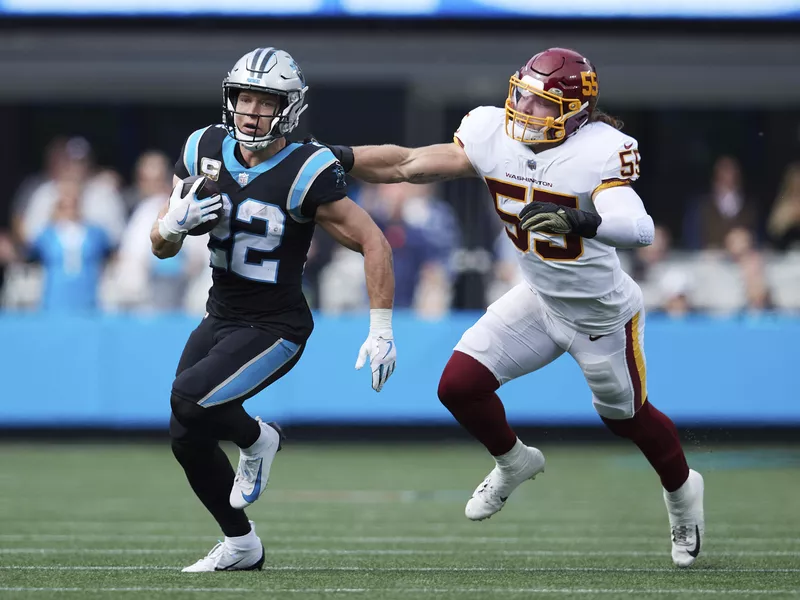 Christian McCaffrey runs down field