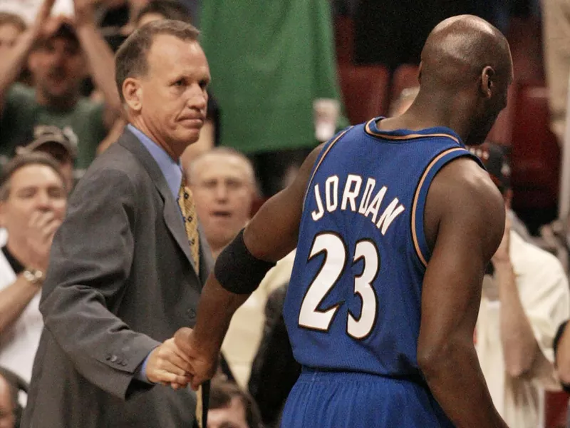 Washington Wizards Doug Collins watches Michael Jordan leave the court