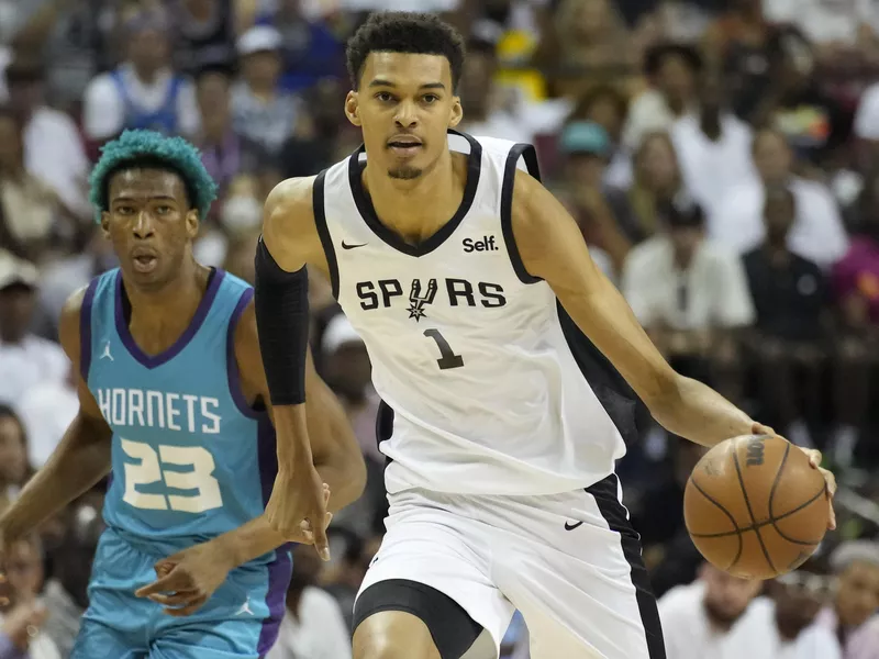 Victor Wembanyama drives against the Charlotte Hornets