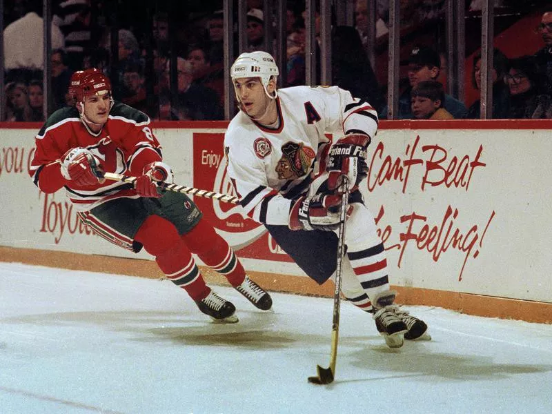 Chicago Blackhawks' Chris Chelios moves puck