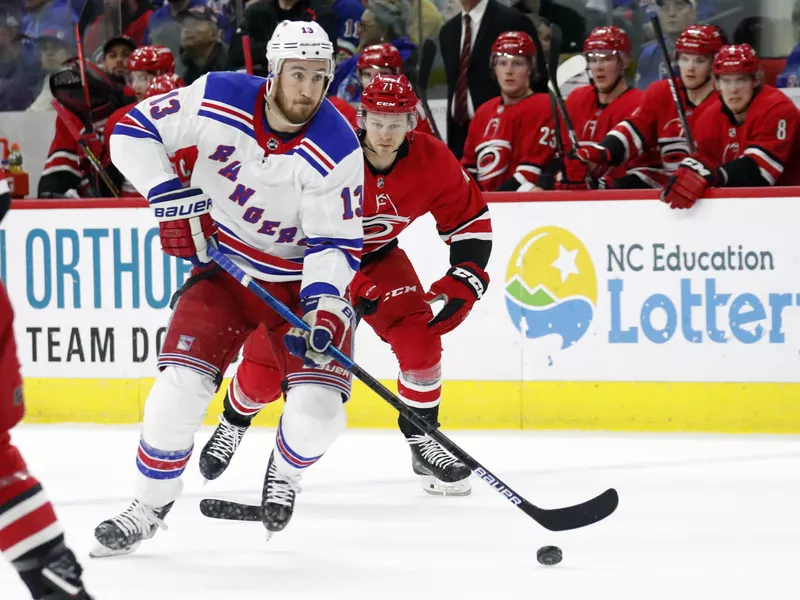 New York Rangers' Kevin Hayes drives against Carolina Hurricanes' Lucas Wallmark