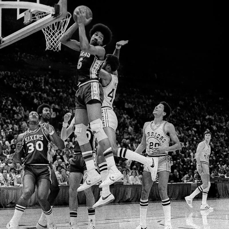 Philadelphia '76ers Julius Erving sweeps rebound