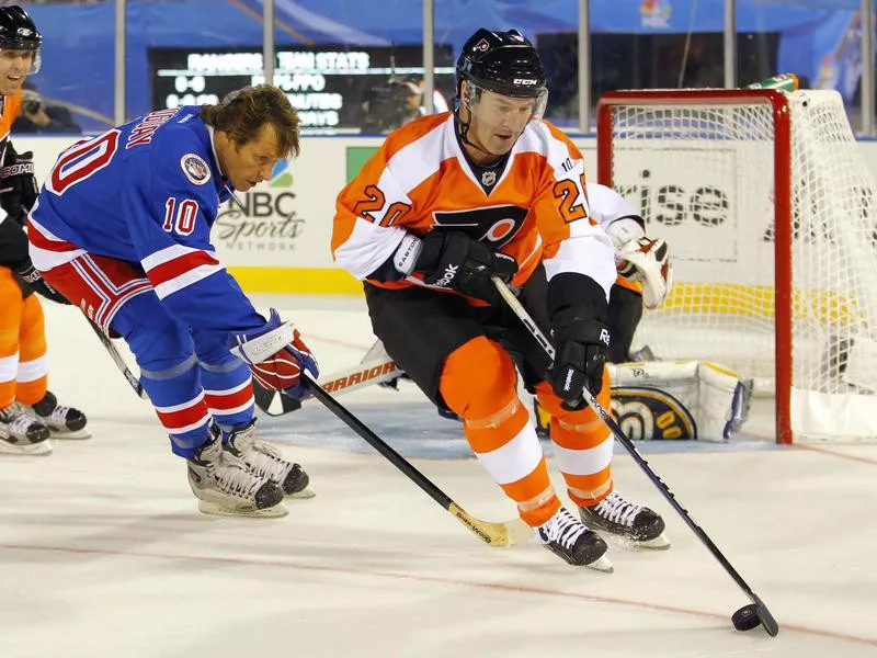 Dave Poulin clears the puck