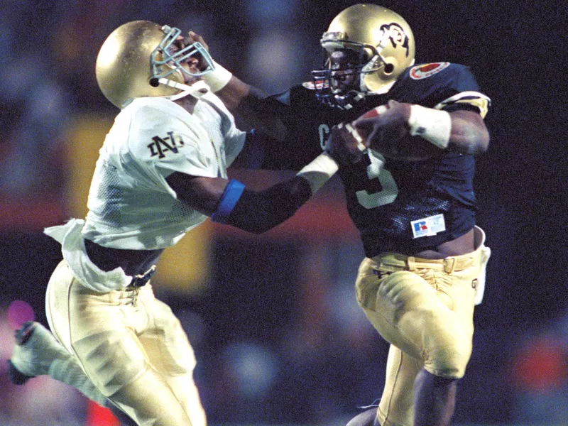 Colorado quarterback Darian Hagan and Notre Dame cornerback Todd Lyght