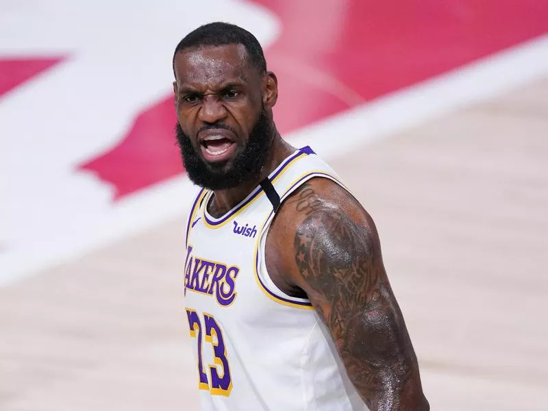 Los Angeles Lakers' LeBron James celebrates after making 3-point shot