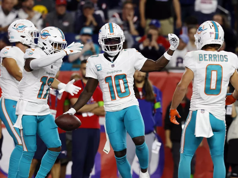 Miami Dolphins wide receivers Tyreek Hill, Jaylen Waddler and Braxton Berrios