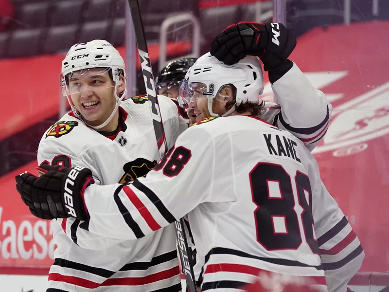 Patrick Kane congratulates Philipp Kurashev