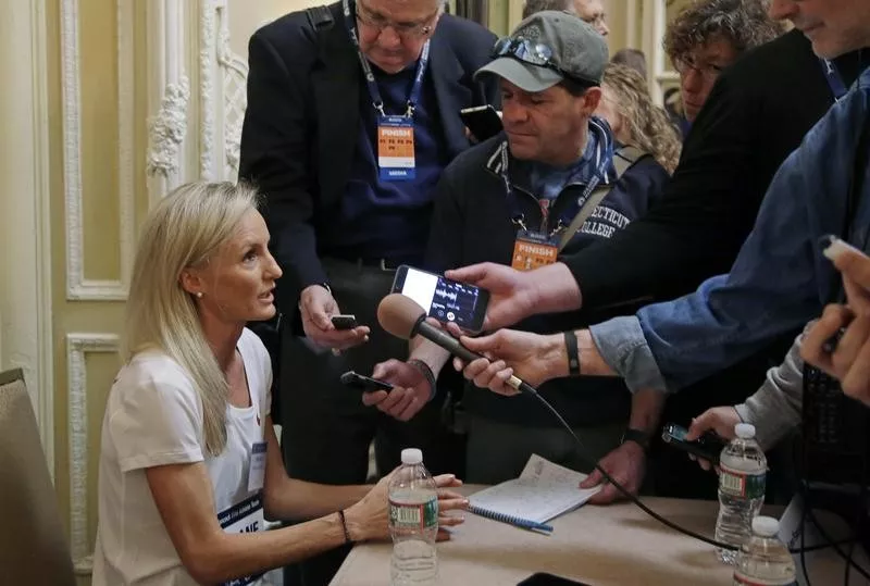 Shalane Flanagan of the U.S. talks with reporters after 2018 Boston Marathon