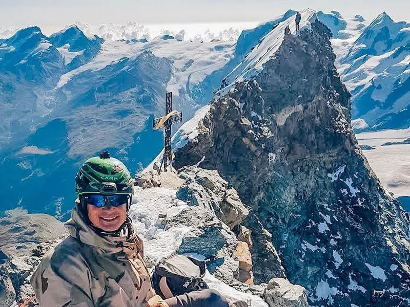 Climber on top of the Matterhorn, Switzerland