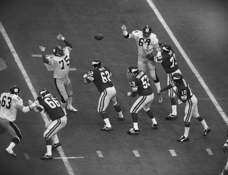 Joe Greene gets ready to block pass by Minnesota Vikings quarterback Fran Tarkenton