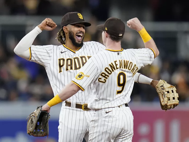 San Diego Padres shortstop Fernando Tatis Jr., celebrates with second baseman Jake Cronenworth