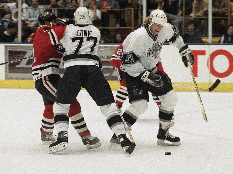 Los Angeles Kings defenseman Marty McSorley looking at puck