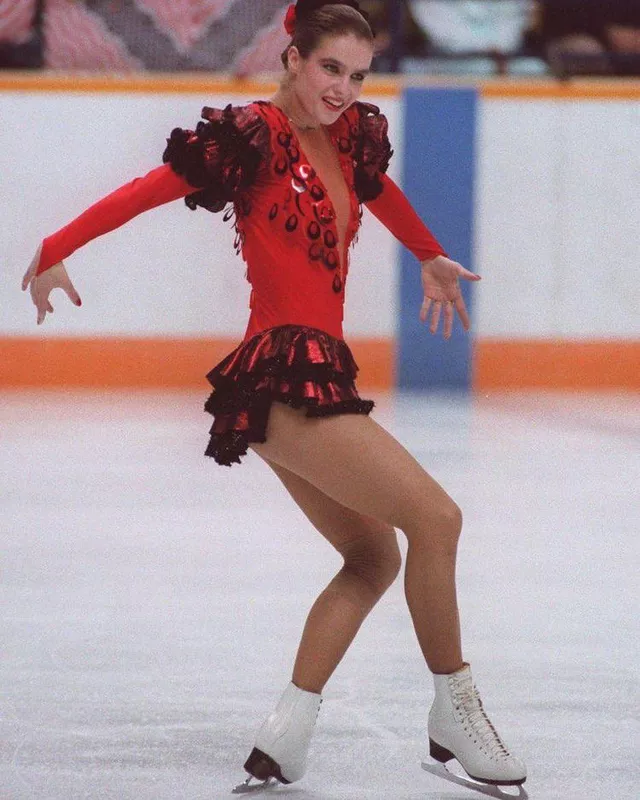 Katarina Witt in red and black dress