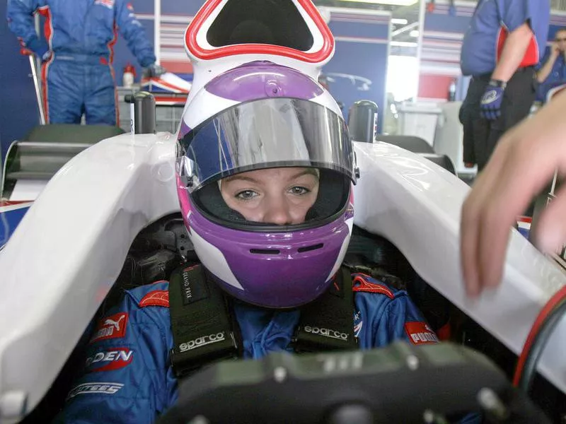 Katherine Legge sits in car