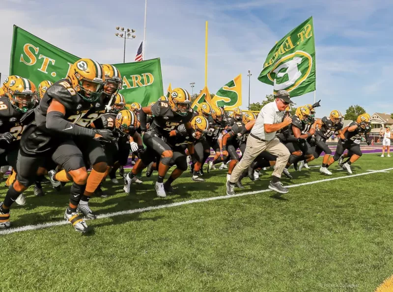 Tom Lombardo with the St. Edward High School football team