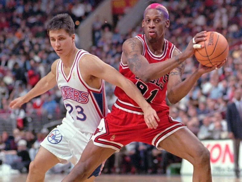 Dennis Rodman looks to pass against Philadelphia 76ers