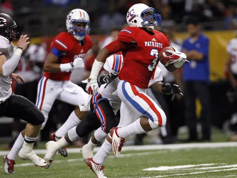 John Curtis Christian School's George Moreira runs for a touchdown