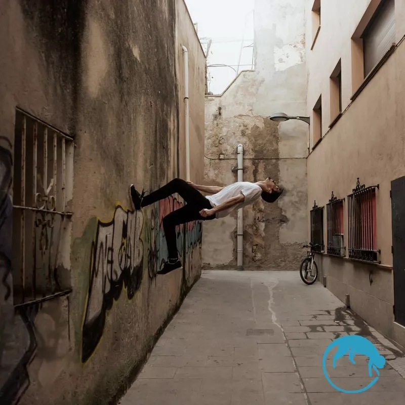 Man walking up wall