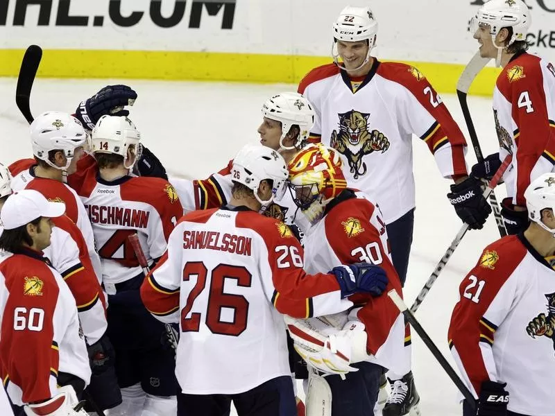 Florida Panther Mikael Samuelsson congratulates goalie Scott Clemmenson