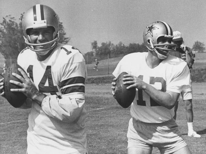 Craig Morton and Roger Staubach loosen up their throwing arms