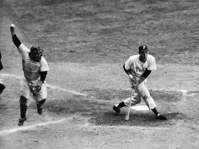 Catcher Yogi Berra celebrating