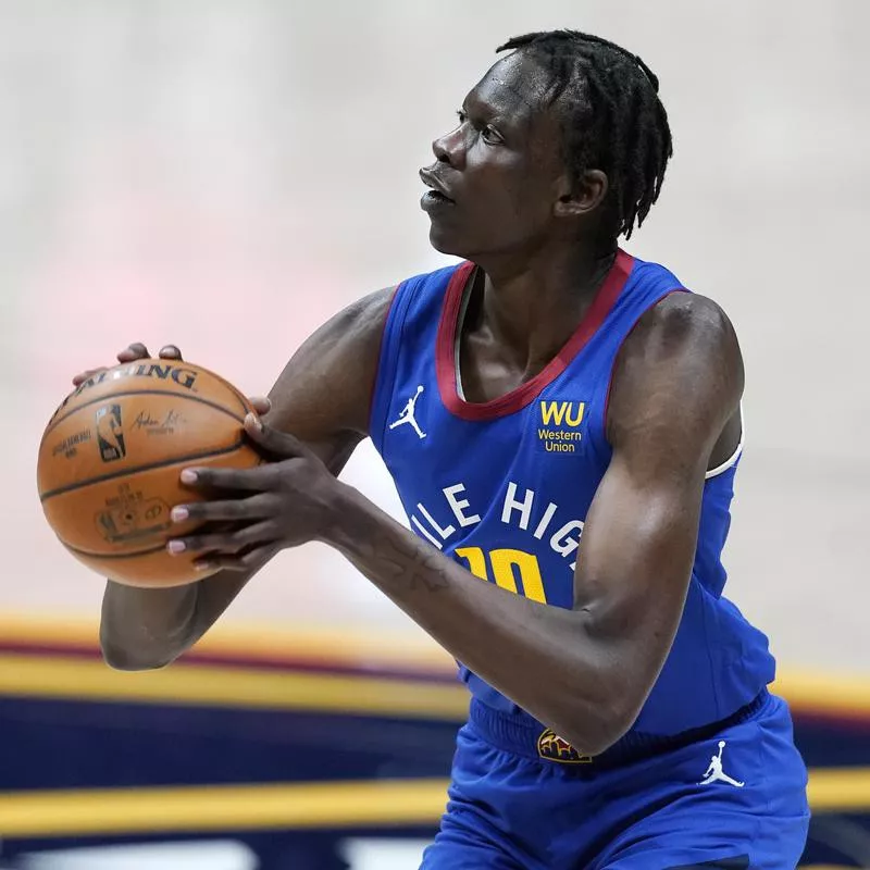 Denver Nuggets center Bol Bol holds ball