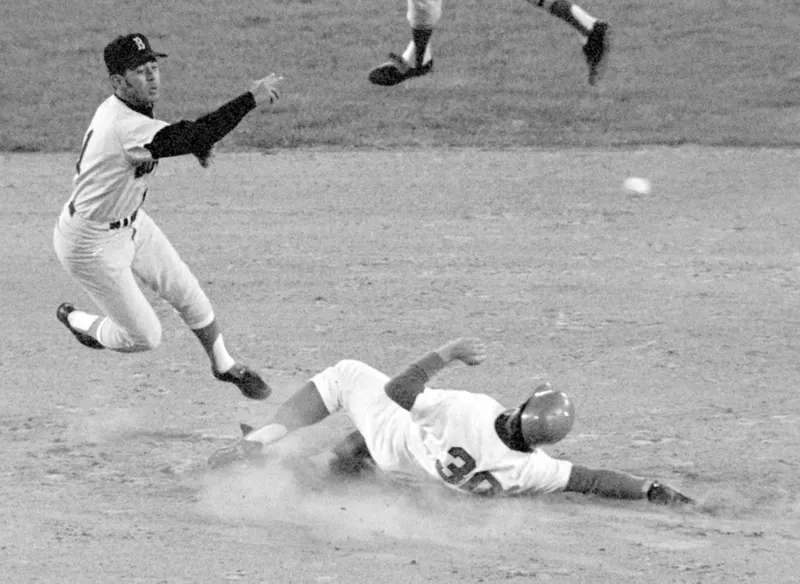 Boston Red Sox shortstop Luis Aparicio fires to first