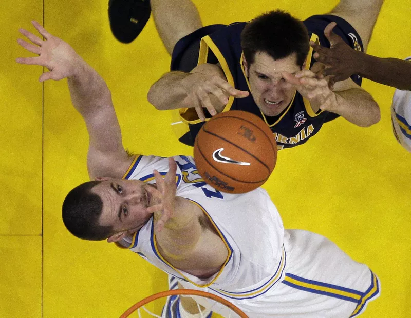 UCLA's Kevin Love blocks layup by California's Ryan Anderson