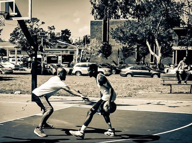 Men playing at Mosswood Park Basketball Courts