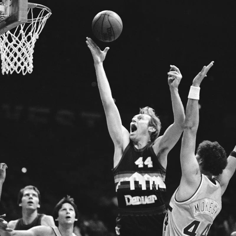 Denver Nuggets center Dan Issel lets out yelp as he out positions Cleveland Cavalier center Paul Mokeski