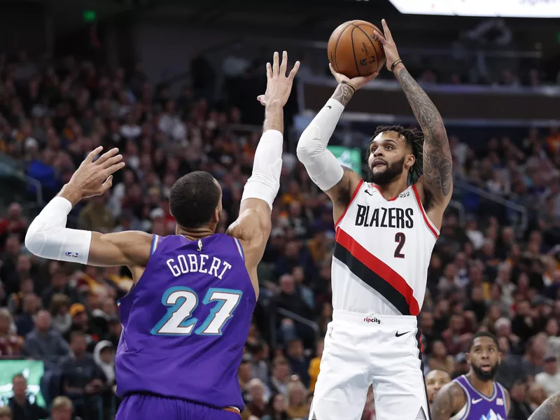 Portland Trail Blazers guard Gary Trent Jr. shoots against Utah Jazz center Rudy Gobert