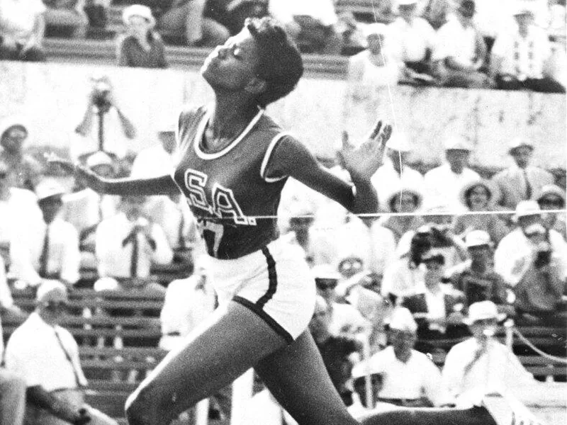 Wilma Rudolph crossing finish line