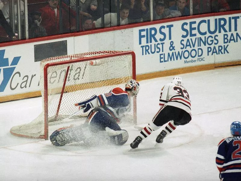 Chicago Blackhawks' Dirk Graham skates pasts Edmonton Oiler's goalie Bill Ranford