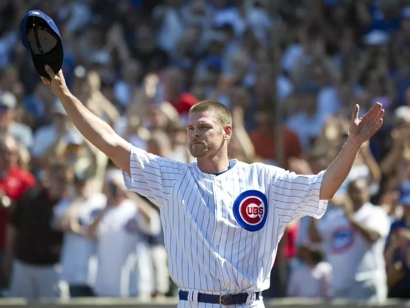 Chicago Cubs relief pitcher Kerry Wood tips his hat to crowd