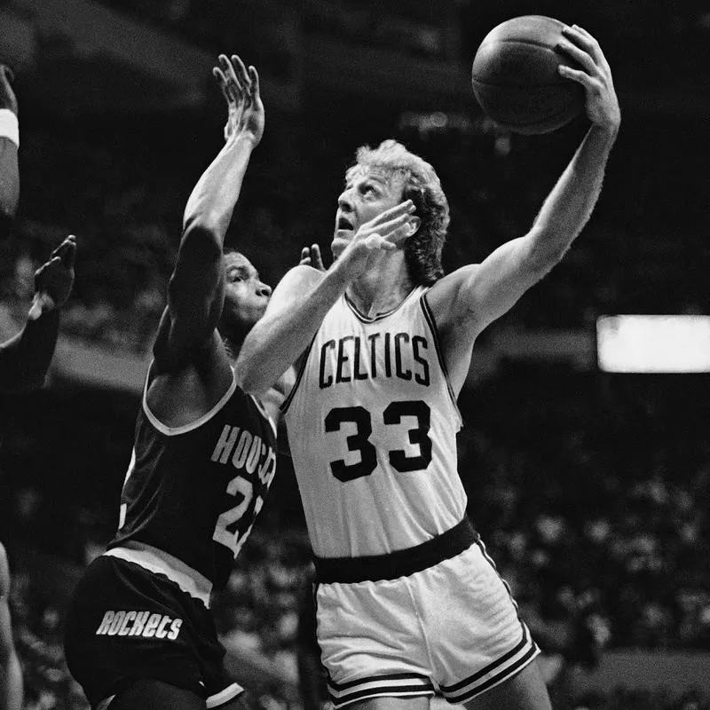 Larry Bird goes up against Houston's Rodney McCray