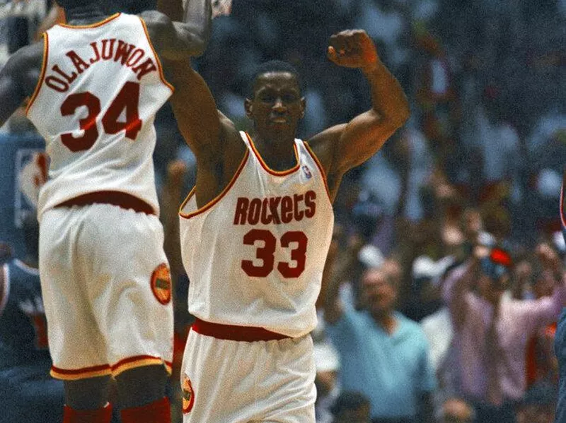 Otis Thorpe celebrates with Hakeem Olajuwon