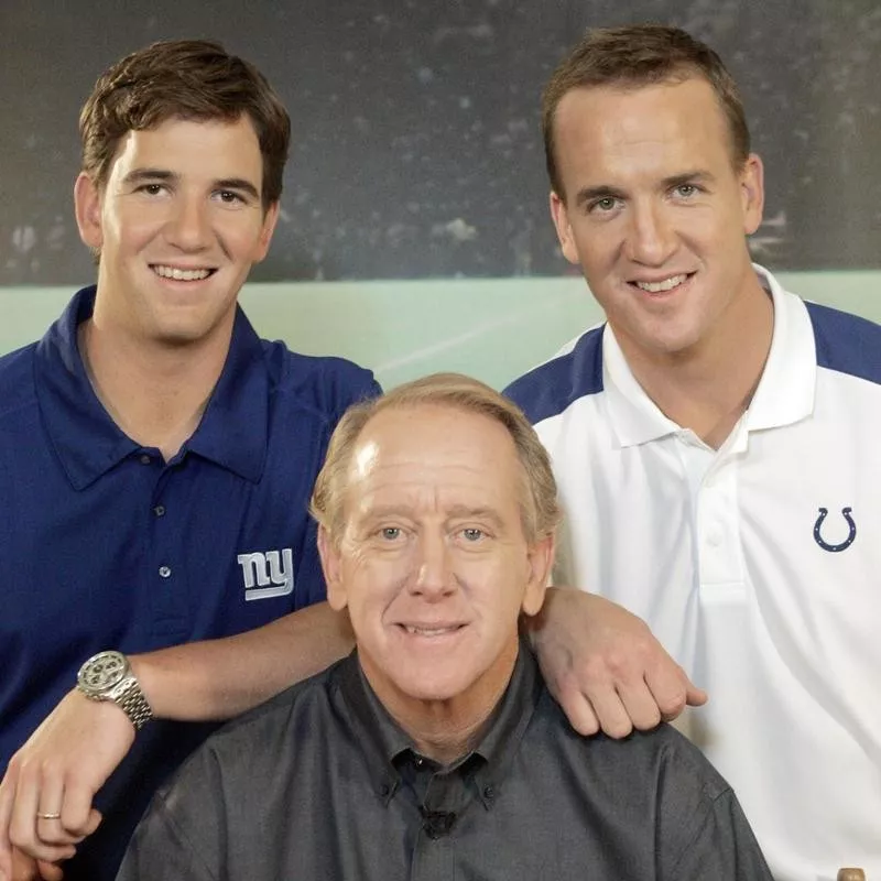 Archie Manning poses with Eli Manning and Peyton Manning on set of DirecTV commercial