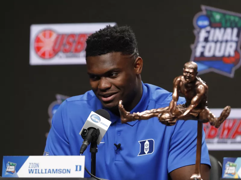 Duke freshman Zion Williamson sits behind Oscar Robertson Trophy