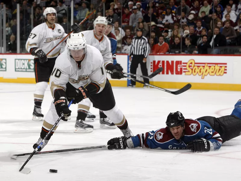 Corey Perry works the puck past Colorado Avalanche defenseman Scott Hannan