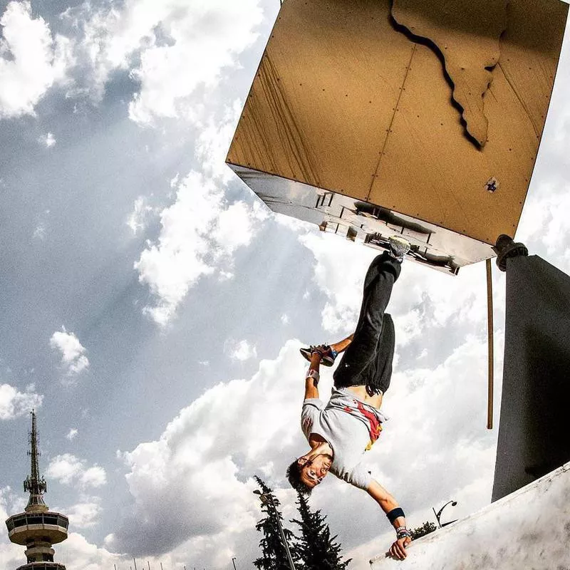 Man doing one arm handstand