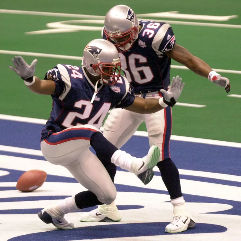 New England Patriots cornerback Ty Law celebrates his interception