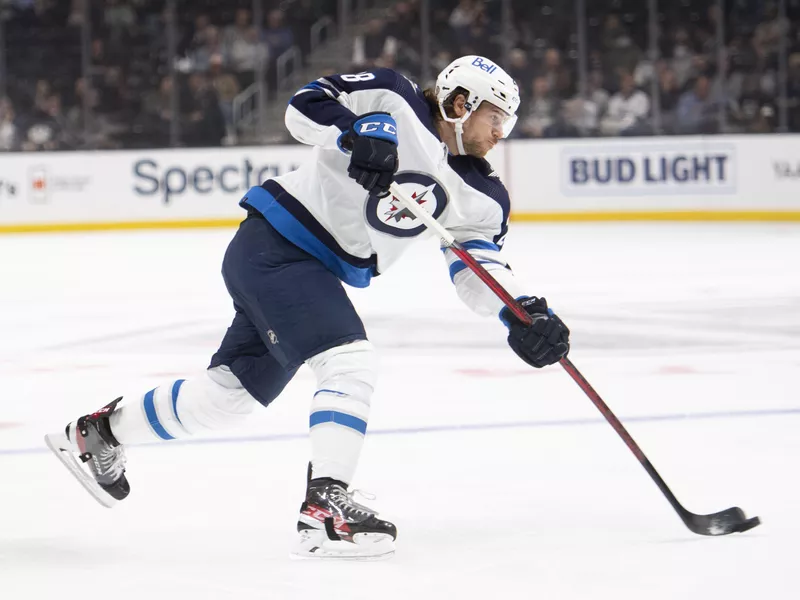 Winnipeg Jets defenseman Nate Schmidt shoots during an NHL hockey game