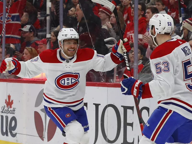 Max Domi celebrates with Victor Mete