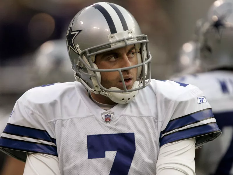 Dallas Cowboys quarterback Drew Henson adjusts sweatband